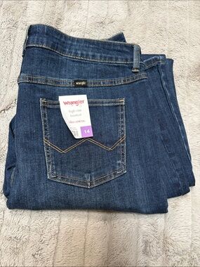 Women’s Wrangler High-Rise Bootcut Jeans in Dark Indigo Blue free to stretch
